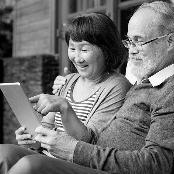 Photo of a senior couple viewing a tablet